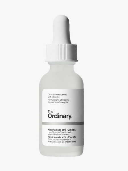 Bottle of The Ordinary Niacinamide 10% + Zinc 1% Serum with white cap on light gray background