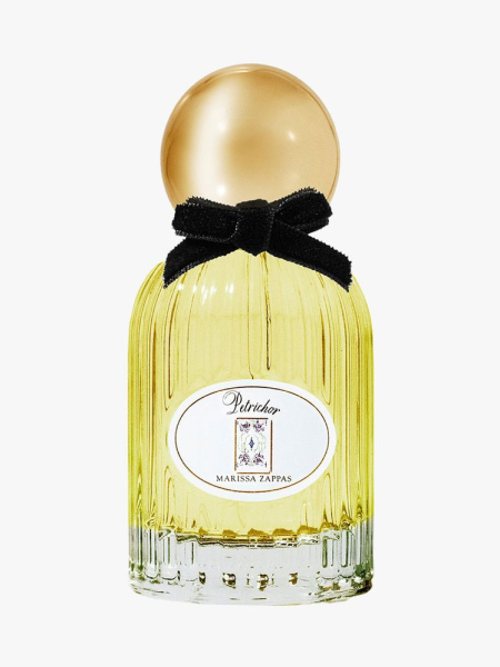 Gold bottle of Marissa Zappas Petrichor Eau de Parfum with gold cap and black bow on light gray background